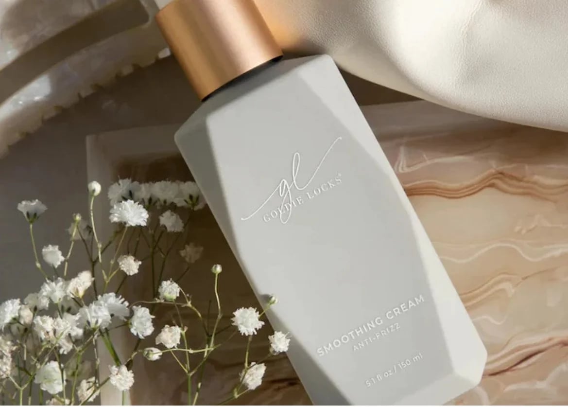 Warm candlelight and soft spa towels in an elegant, luxurious setting